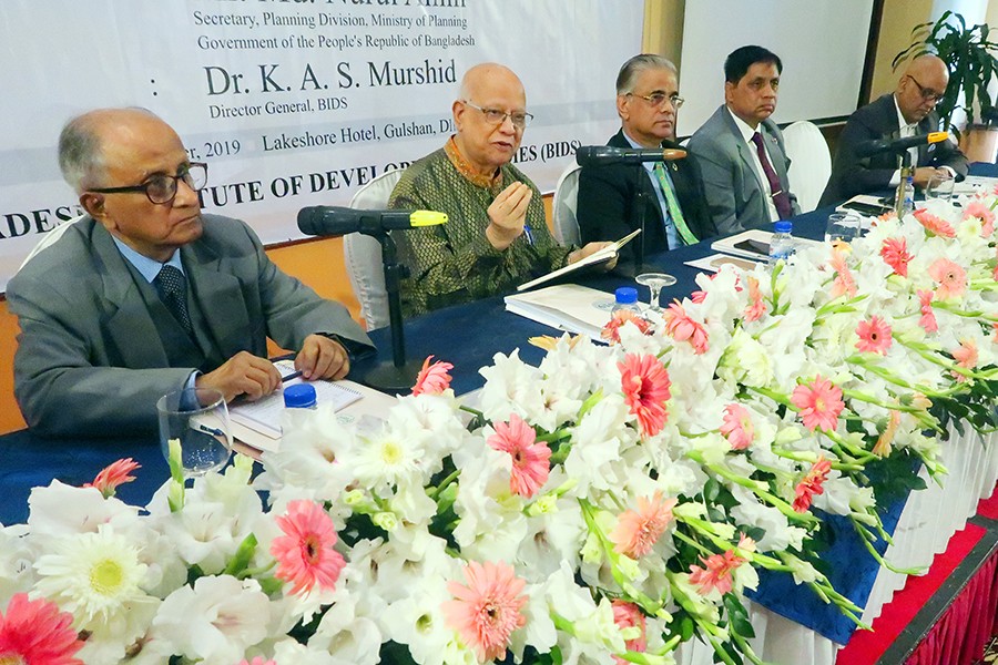 Former Finance Minister A M A Muhith speaking at the inaugural session of the BIDS-organised two-day research almanac in the city on Sunday. Former finance minister M. Syeduzzaman (extreme left), Bangladesh Planning Commission Member Dr. Shamsul Alam (centre), Planning Division Secretary Md. Nurul Alam (2nd, right) and BIDS Director General Dr K A S Murshid are also seen — FE Photo