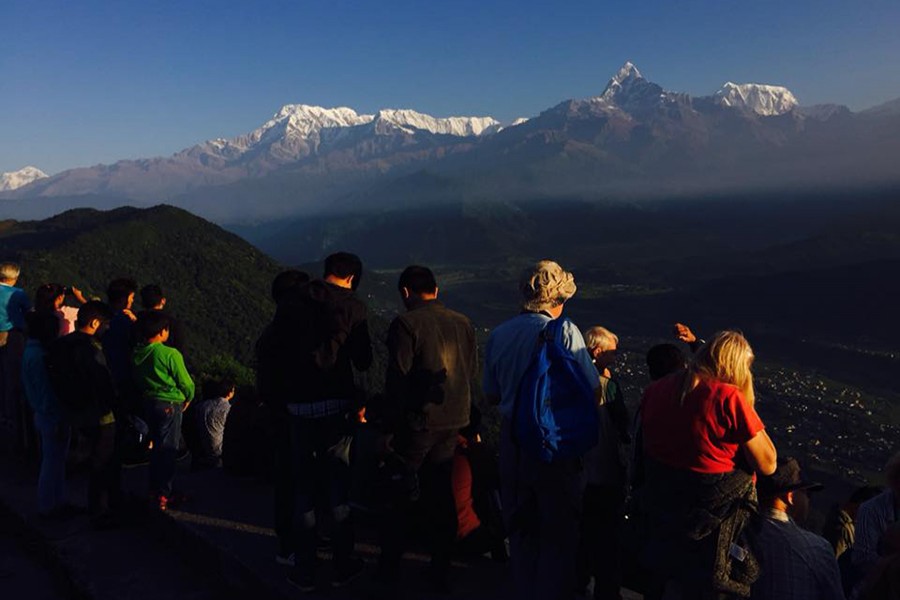 Tourists enjoying the gorgeous view during sunrise at Sarangkot, in Nepal's Pokhara. Courtesy: Nepal Tourism Promotion via Facebook