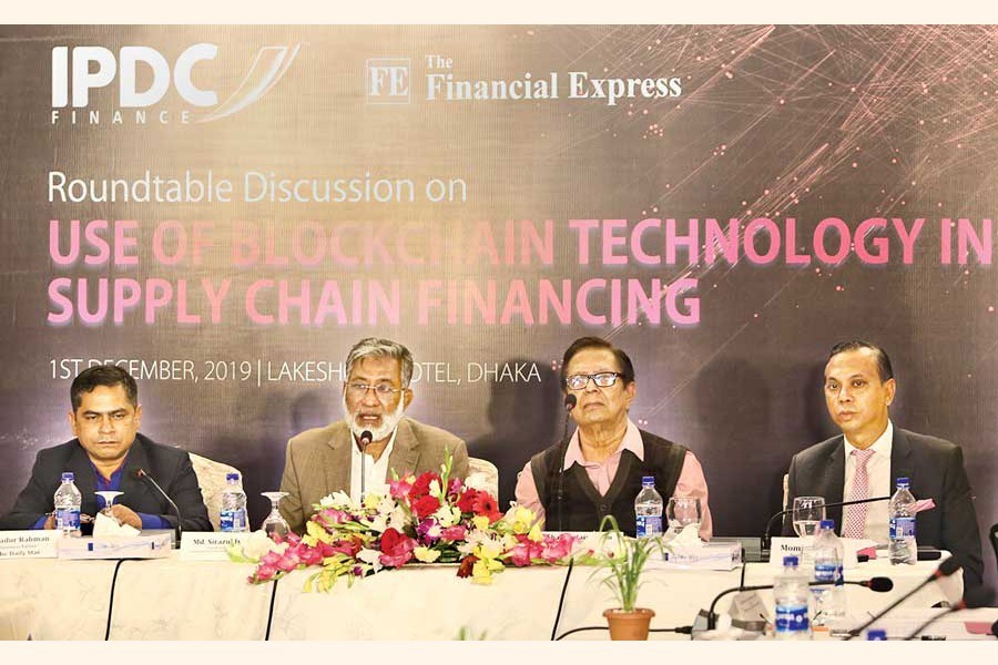 BIDA Executive Chairman Sirazul Islam (2nd from left) speaking at a roundtable on 'Use of Blockchain Technology in Supply Chain Financing' at a city hotel on Sunday. The Financial Express Editor Shah Husain Imam (2nd from right) and IPDC Finance Limited Managing Director Mominul Islam (extreme right) also spoke — FE photo