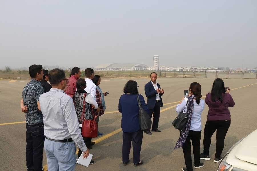 Naresh Pradhan, senior project officer (transport) at ADB's Nepal Resident Mission, briefing a media team on the newly constructed runway of Goutam Buddha International Airport (GBIA) at Bhairahawa, Nepal recently