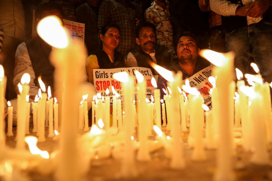 People attending a candle light march to protest against the alleged rape and murder of a 27-year-old woman on the outskirts of Hyderabad, in New Delhi, India. - Reuters
