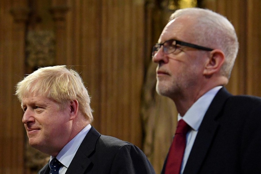 Britain's prime minister Boris Johnson and main opposition Labour Party leader Jeremy Corbyn head the procession of members of parliament through the Central Lobby toward the House of Lords to listen to the Queen's Speech during the State Opening of Parliament in the Houses of Parliament in London, Britain, October 14, 2019. Reuters/Files