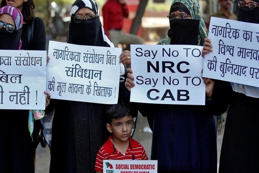 Demonstrators display placards during a protest against the Citizenship Amendment Bill, a bill that seeks to give citizenship to religious minorities persecuted in neighbouring Muslim countries, in Ahmedabad, India, December 9, 2019. Reuters