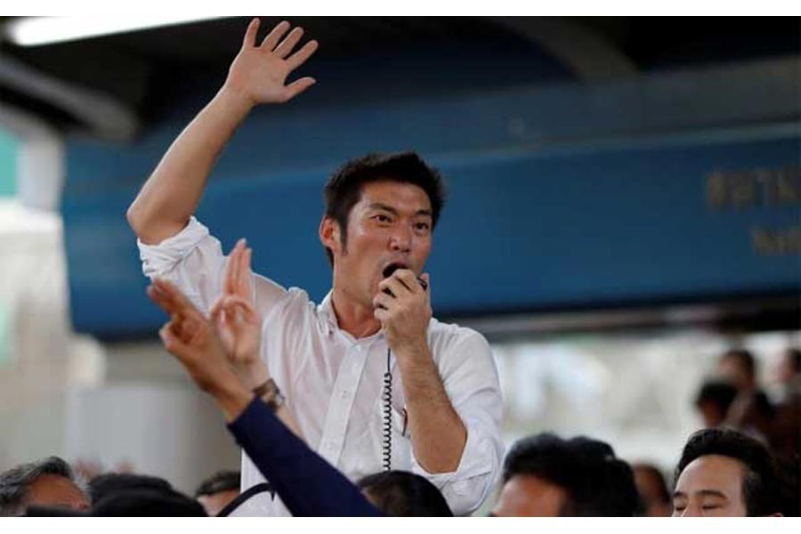 Thanathorn Juangroongruangkit of Thailand's progressive Future Forward Party talks to his supporters during an unauthorised flash mob rally in Bangok, Thailand Dec 14, 2019. REUTERS