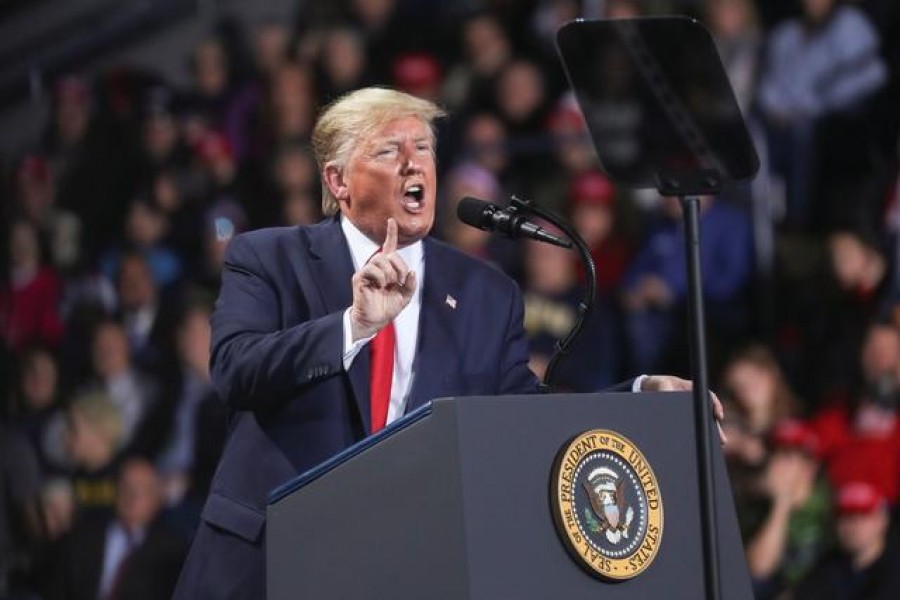 US President Donald Trump reacts while speaking during a campaign rally in Battle Creek, Michigan, US, December 18, 2019. Reuters
