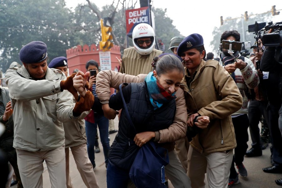 A demonstrator is detained during a protest against a new citizenship law, in Delhi, December 19, 2019. REUTERS/Danish Siddiqui