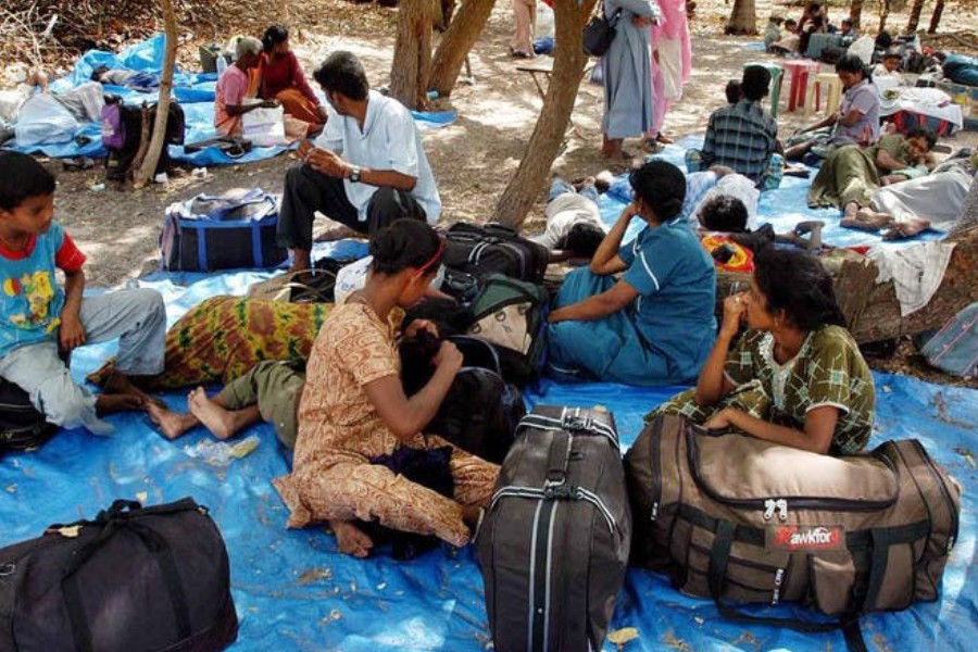 Tamil refugees who arrived from Sri Lanka, rest at Dhanushkodi, about 675 kilometers (421 miles) south of Madras, India - Reuters file photo