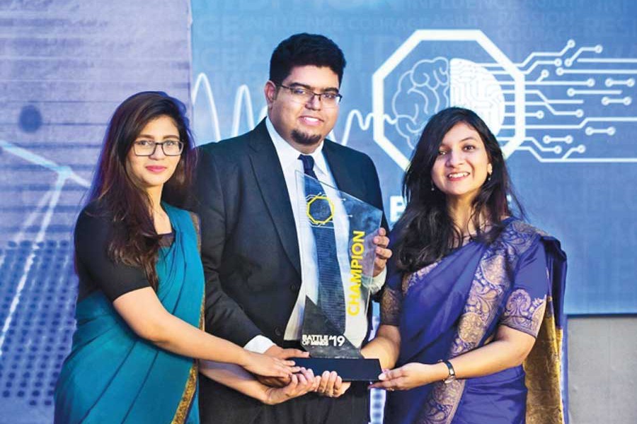 Winners of Battle of Minds 2019 -- The Beetles from IBA, University of Dhaka-- Silvana Jahir, Khondaker Mushfiqur Rahman and Saima Mehedi Khan (from left to right) holding the champion trophy