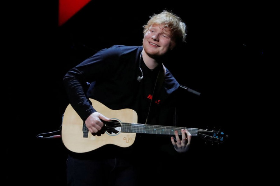 FILE PHOTO: Ed Sheeran performs during the 2017 Jingle Ball at Madison Square Garden in New York - Reuters