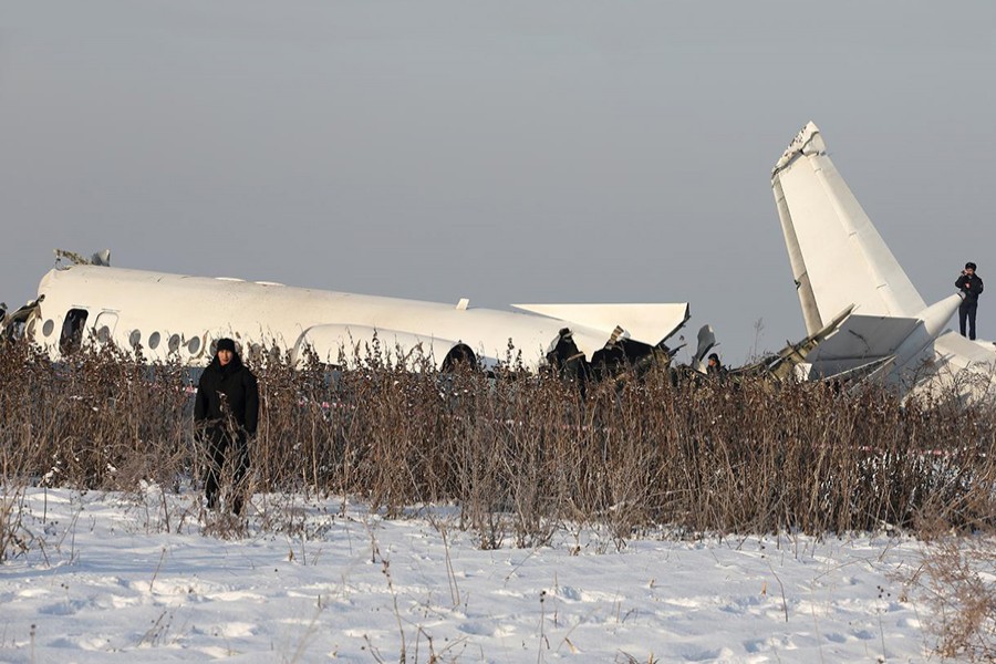Emergency and security personnel are seen at the site of a plane crash near Almaty, Kazakhstan on December 27, 2019 — Reuters photo