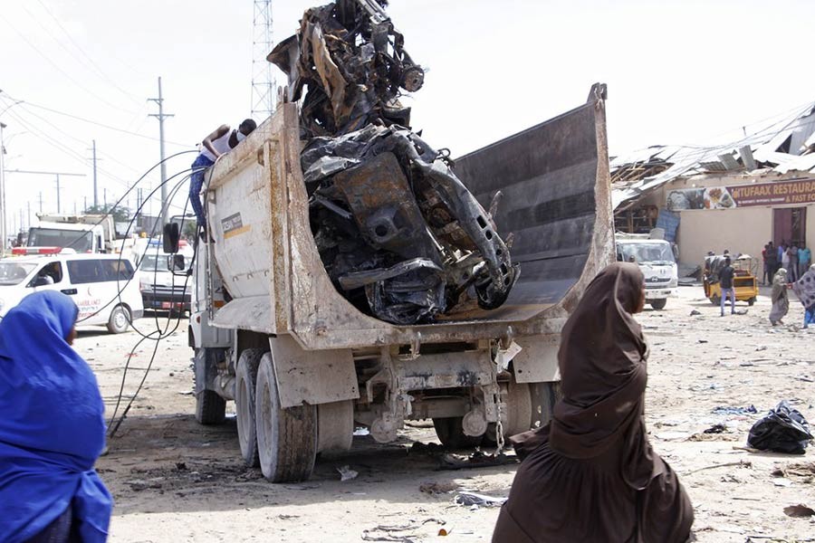 A truck carrying wreckage of a car used in a car bomb in Somalia on Saturday. -AP Photo
