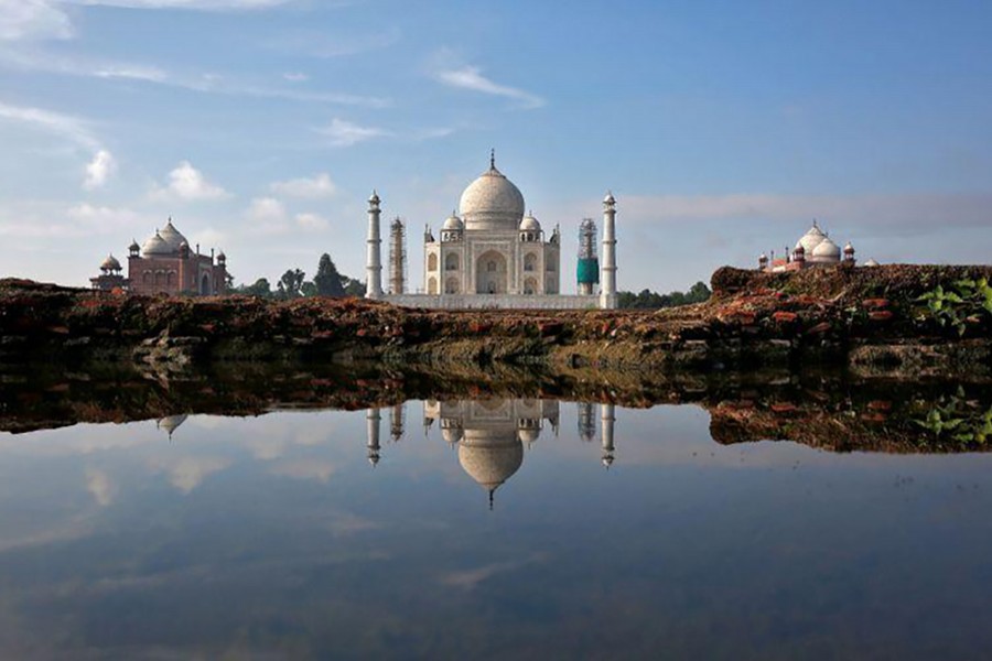 The Taj Mahal is reflected in a puddle in Agra, India on August 9, 2016 — Reuters/Files