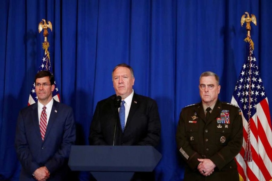 US Secretary of State Mike Pompeo speaks about air strikes by the US military in Iraq and Syria, at the Mar-a-Lago resort in Palm Beach, Florida, US, December 29, 2019. With him are US Army General Mark Milley and US Defense Secretary Mark Esper. Reuters