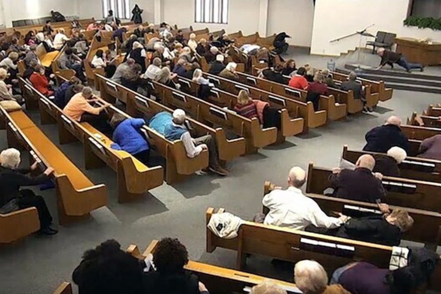 In this still frame from livestreamed video provided by law enforcement, churchgoers take cover while a congregant armed with a handgun, top left, engages a man who opened fire, near top center just right of windows, during a service at West Freeway Church of Christ, Sunday, Dec. 29, 2019, in White Settlement, Texas -  (West Freeway Church of Christ/Courtesy of Law Enforcement via AP)