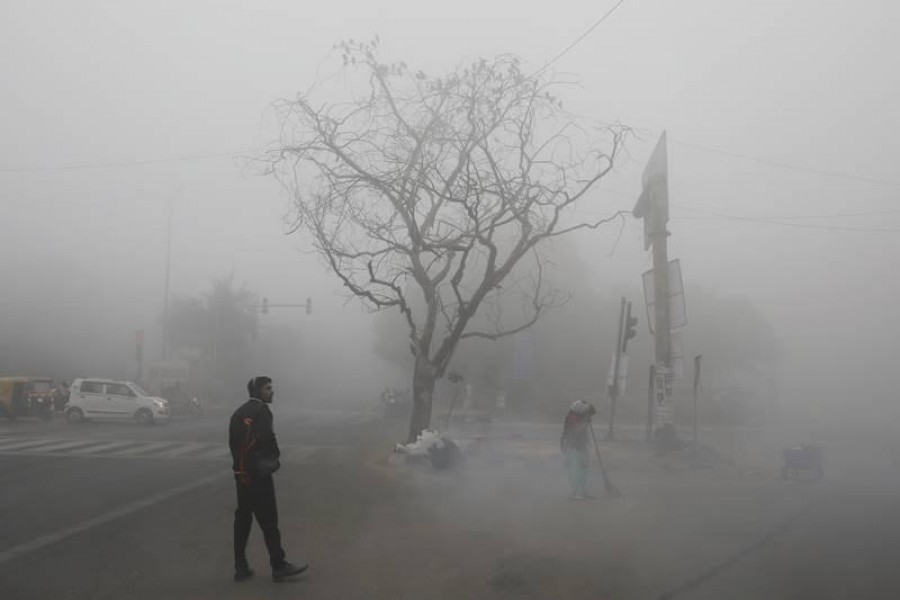 A thick blanket of fog engulfed the national capital on Monday morning affecting train and flight operations as visibility dropped drastically, with some observatories recording it at zero metres - AP Photo