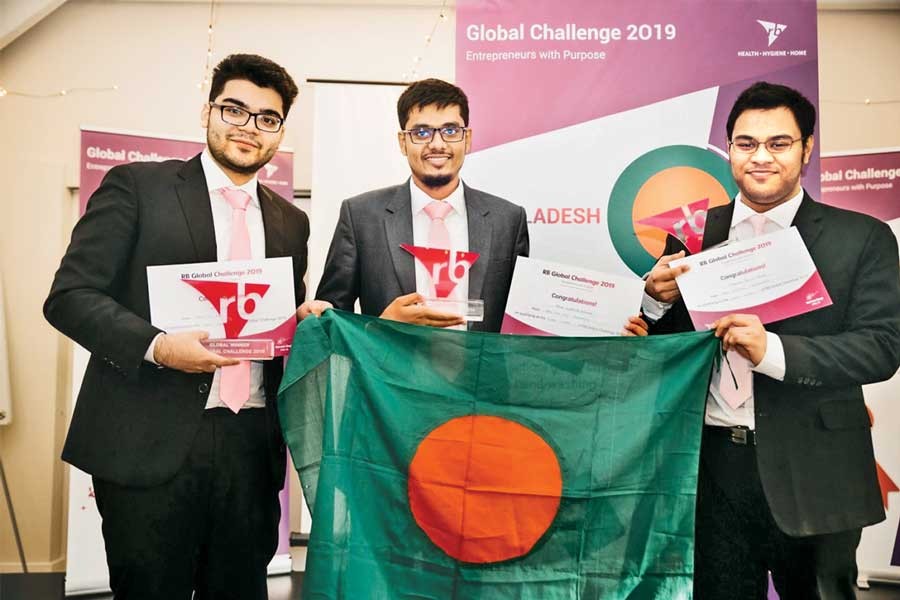 Winners of RB Global Challenge 2019 —Team Who Dis from North South University— (left to right) Syed Towhid Bashar, Mahdi Mohammad Mehrab and Mohammad Tahsin Nawaz  holding the champion trophy and the flag of Bangladesh