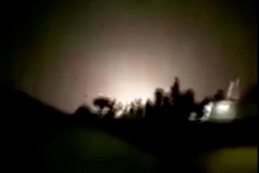An explosion is seen following missiles landing at what is believed to be Ain al-Asad Air Base in Iraq, in this still image taken from a video shot on January 8, 2020 — Iran Press/Handout via REUTERS