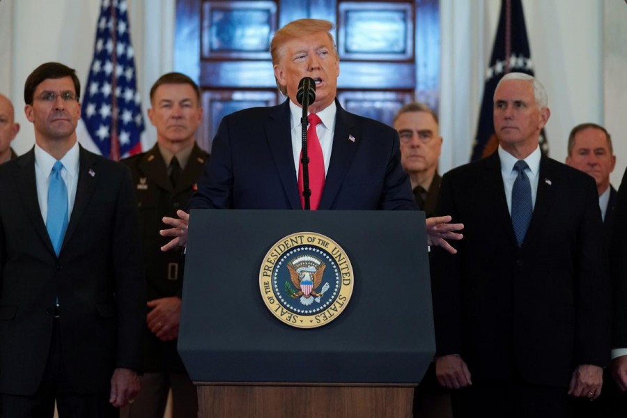 US president Donald Trump delivers a statement about Iran flanked by US secretary of defence Mark Esper, vice president Mike Pence and military leaders in the Grand Foyer at the White House in Washington, US, January 08, 2020. Reuters