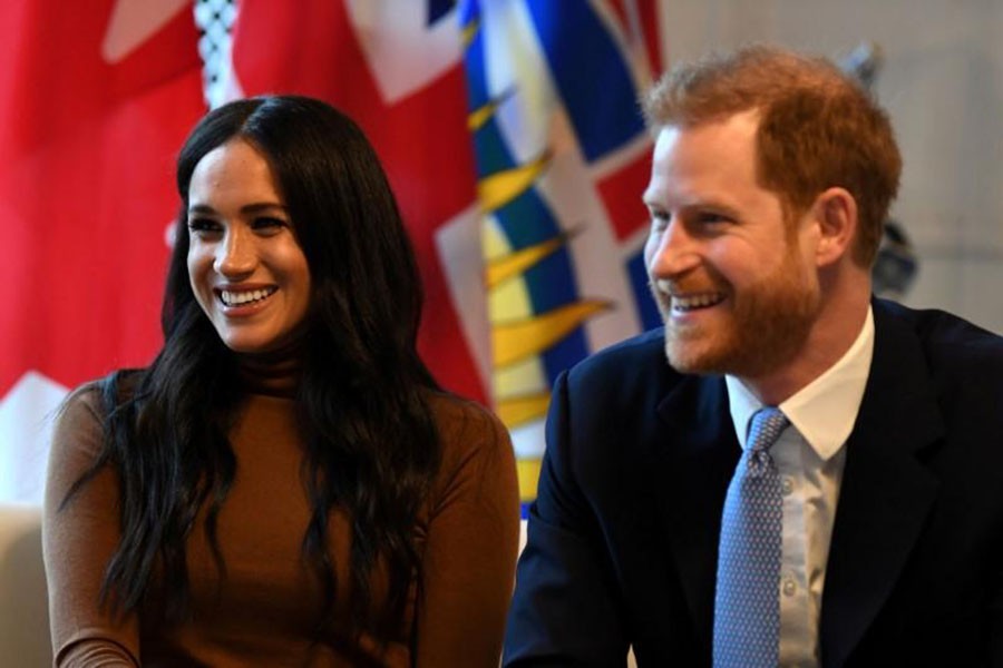 Britain's Prince Harry and his wife Meghan