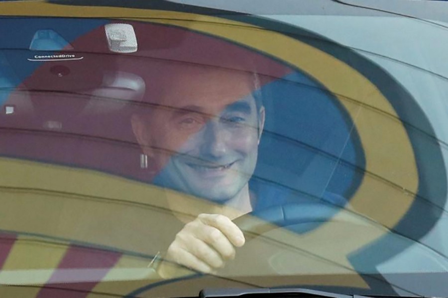 Ernesto Valverde leaves Joan Gamper training camp, as Barcelona's logo is reflected on the window of his car on January 13, 2020 — Reuters photo