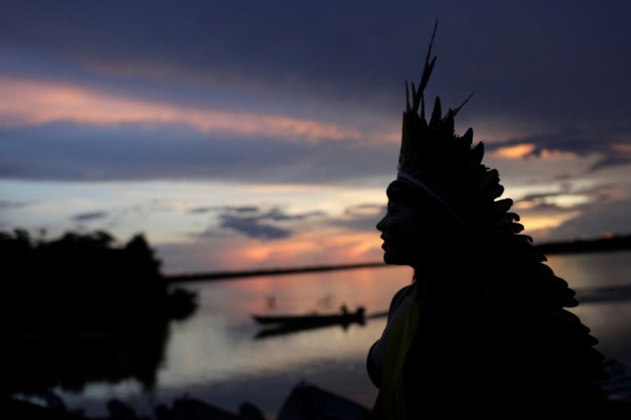 Indigenous leader of the Celia Xakriaba tribe walks next to the Xingu River during a four-day pow wow in Piaracu village, in Xingu Indigenous Park, near Sao Jose do Xingu, Mato Grosso state, Brazil on January 15, 2020 — Reuters photo