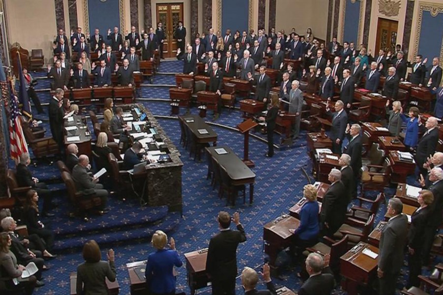 Chief Justice of the United States John Roberts swears in senators during the procedural start of the Senate impeachment trial of US President Donald Trump in this frame grab from video shot in the Senate Chamber at the US Capitol in Washington, US on January 16, 2020 — US Senate TV/Handout via Reuters