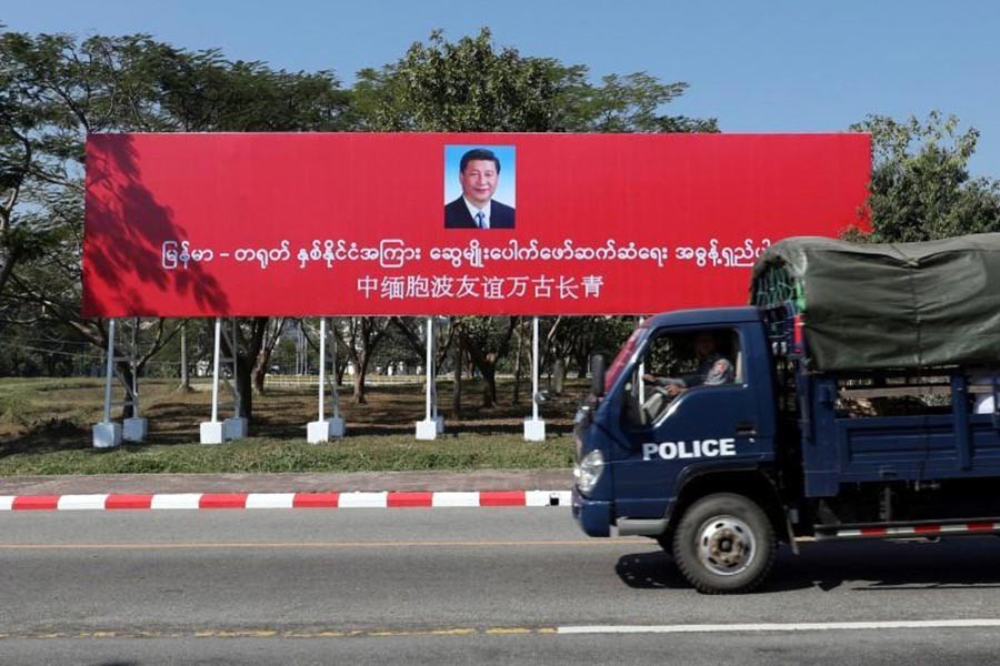 The Reuters photo shows a banner welcoming Chinese President Xi Jinping ahead of his visit to Myanmar in Naypyitaw, Myanmar
