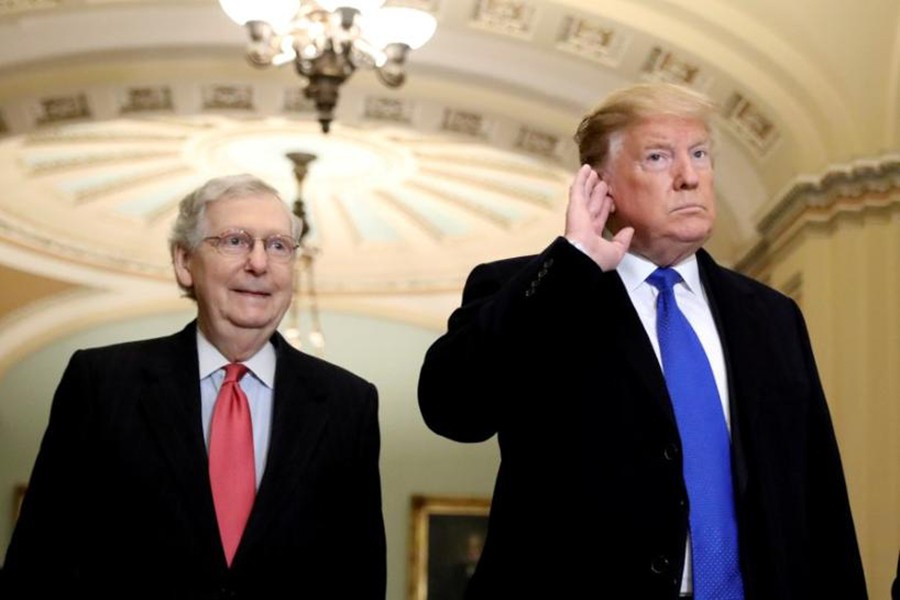 US President Donald Trump listens to a question from reporters next to Senate Majority Leader Mitch McConnell (R-KY) as he arrives for a closed Senate Republican policy lunch on Capitol Hill in Washington, US on March 26, 2019 — Reuters/Files