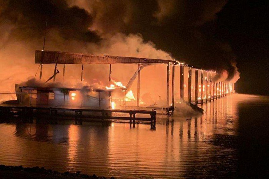 A row of boats are engulfed in flames after catching fire at the marina in Scottsboro, Alabama, US on January 27, 2020 — Southern Torch via REUTERS