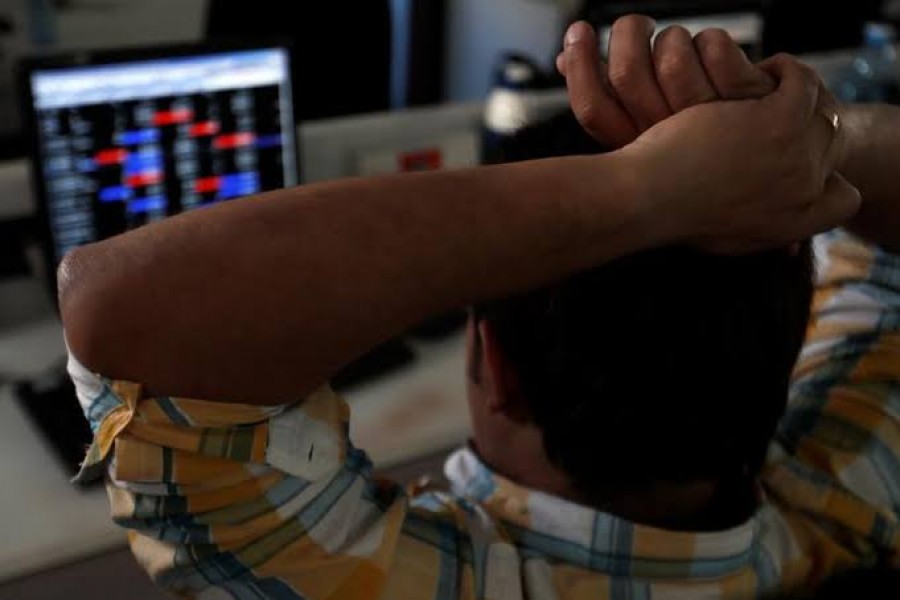 A broker reacts while trading at his computer terminal at a stock brokerage firm in Mumbai, India, February 01, 2020. Reuters