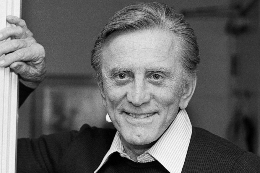 FILE - This Nov. 16, 1982 file photo shows actor Kirk Douglas at his home in Beverly Hills, Calif. Douglas died Wednesday, Feb. 5, 2020 at age 103. (AP Photo/Wally Fong, File)
