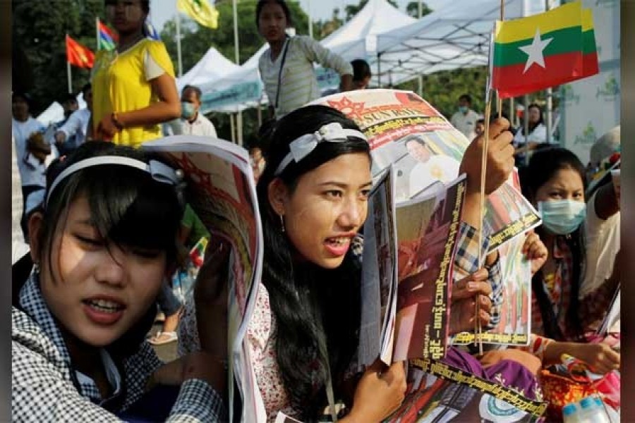 Participants carry Myanmar flags during a nationalist rally in Yangon, Myanmar, February 09, 2020. Reuters