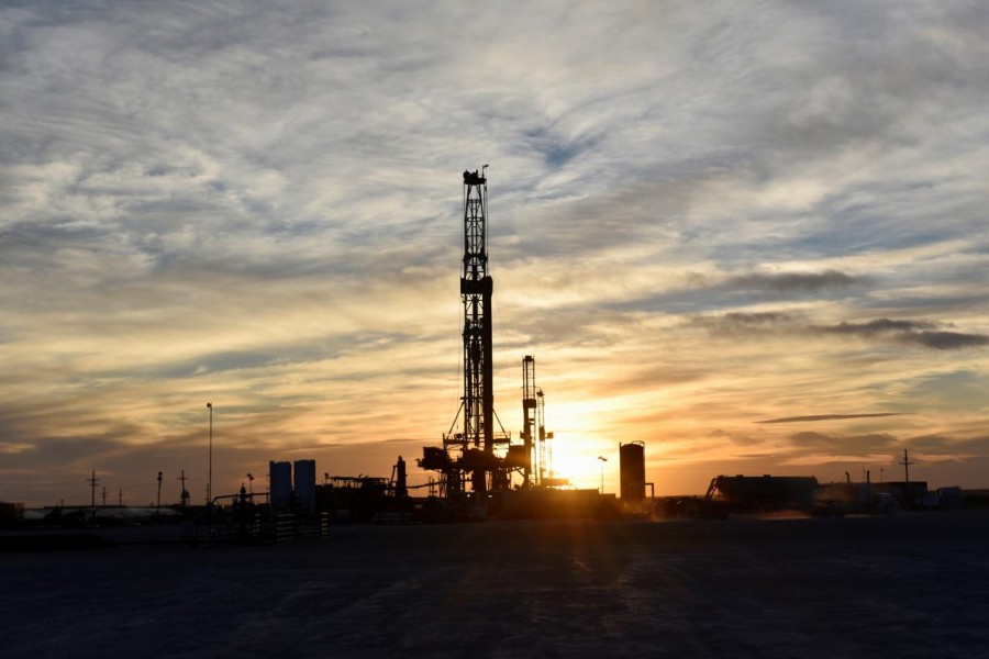 Drilling rigs operate at sunset in Midland, Texas, US, February 13, 2019.Reuters/File Photo