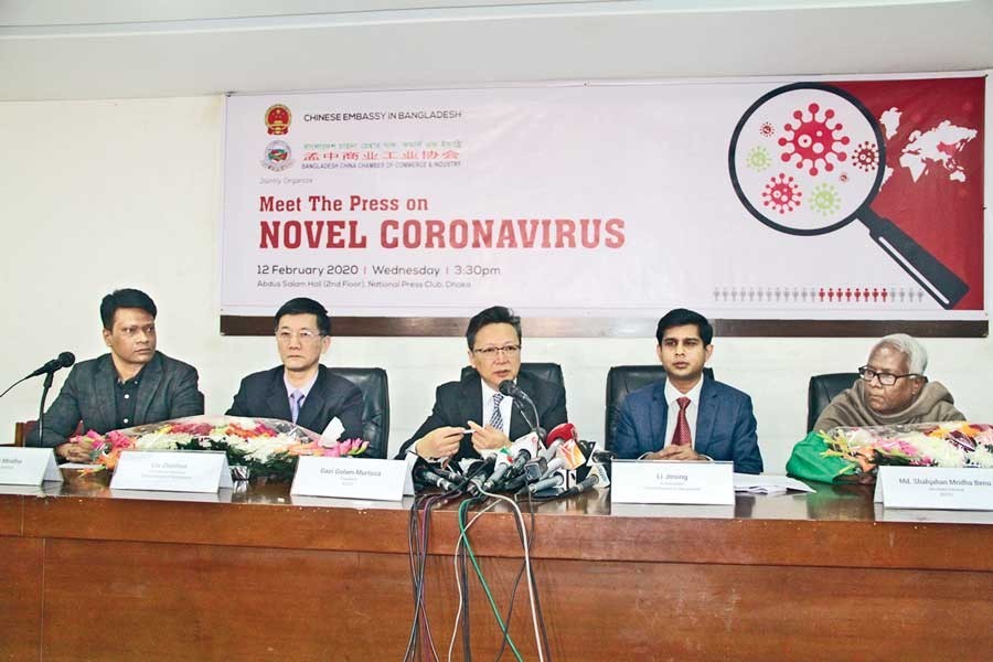 Chinese Ambassador to Bangladesh Li Jiming (centre) addressing a meet the press programme on 'Novel Coronavirus' at the National Press Club on Wednesday — FE Photo