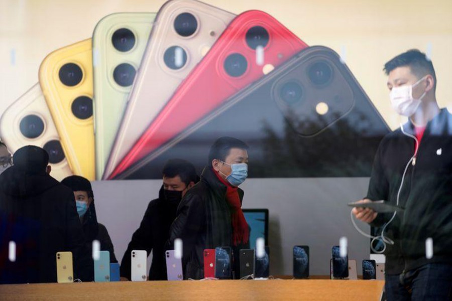 People wearing protective masks are seen in an Apple Store, as China is hit by an outbreak of the new coronavirus, in Shanghai, China on January 29, 2020 — Reuters/Files