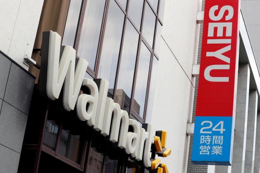 FILE PHOTO: The logos of Walmart and Seiyu are pictured at the headquarters office in Tokyo, Japan July 12, 2018. REUTERS/Kim Kyung-Hoon