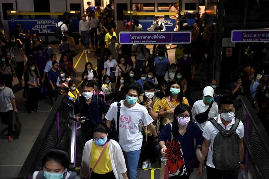 Commuters wearing protective masks as they walk inside the MRT subway in Bangkok, Thailand on February 24, 2020 — Reuters photo