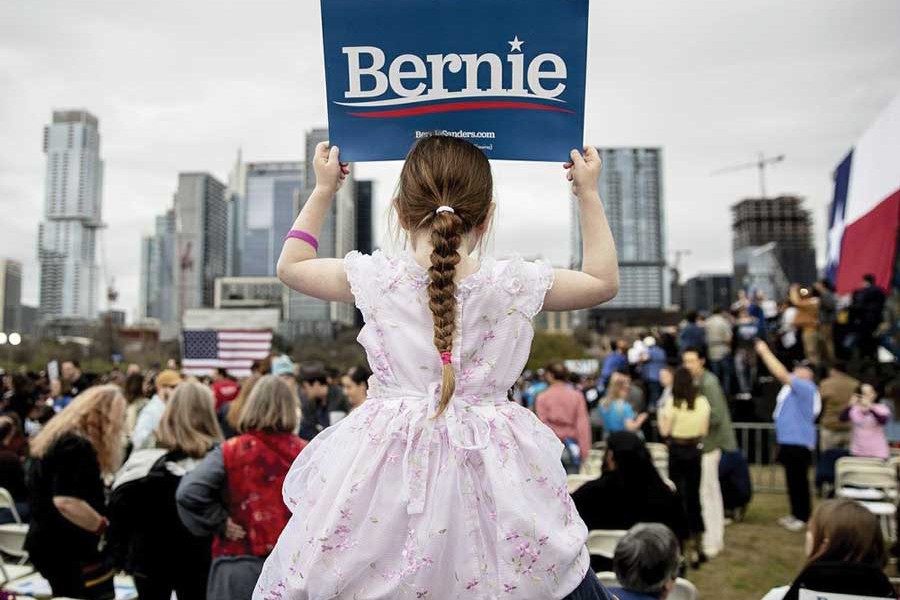 Lily Barbour, 5, holds up a campaign sign for Democratic presidential candidate Senator Bernie Sanders during a campaign event in Austin, Texas, on February 23, 2020. 	—Photo: AP