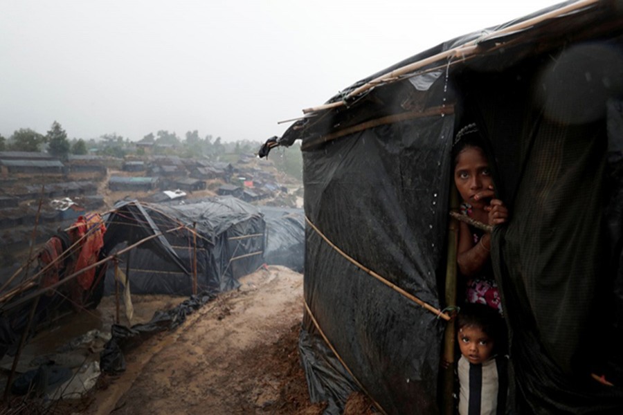 Rohingya refugees look out from a shelter in Cox's Bazar — Reuters/Files