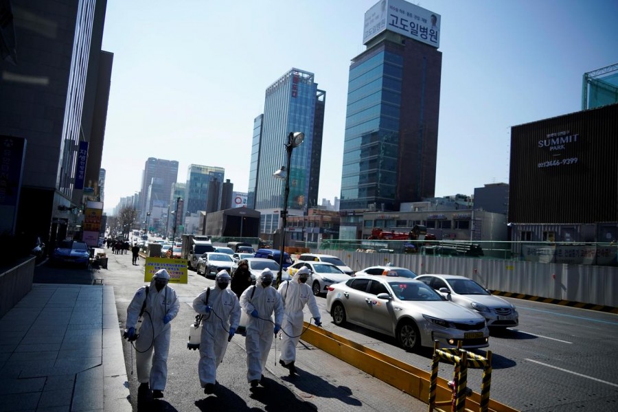 South Korean soldiers in protective gear sanitise a street in Seoul, South Korea, March 05, 2020 — Reuters/Files