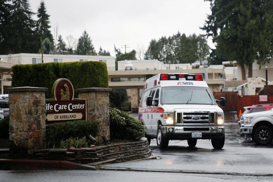 An ambulance drives away with a resident at the Life Care Center of Kirkland, a long-term care facility linked to several confirmed coronavirus cases, in Kirkland, Washington, US, March 6, 2020 — Reuters