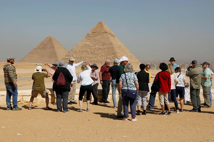 Tourists gather at the Great Pyramids of Giza, on the outskirts of Cairo, Egypt. -Reuters file photo
