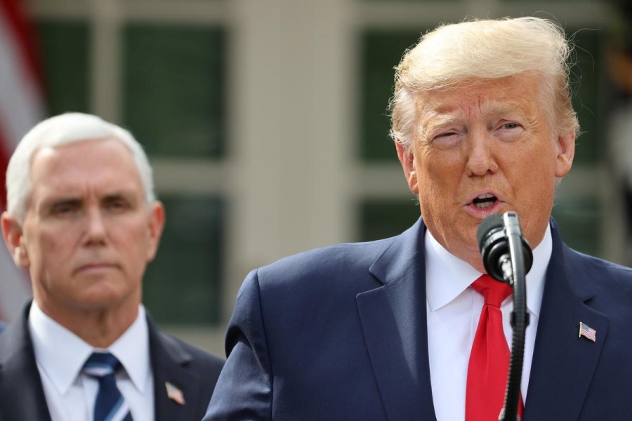 US president Donald Trump declares the coronavirus pandemic a national emergency as vice president Mike Pence listens during a news conference in the Rose Garden of the White House in Washington, US, March 13, 2020. — Reuters