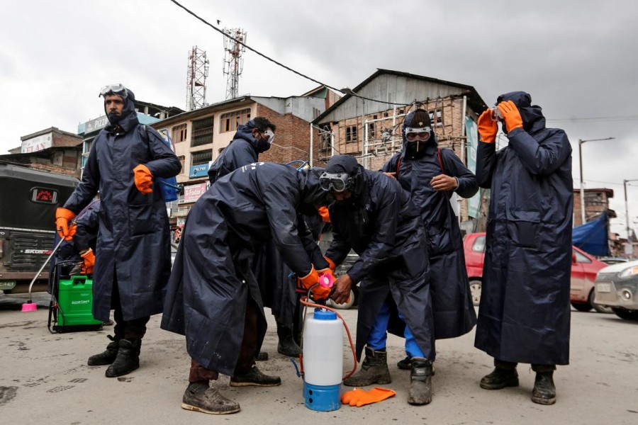 Municipal workers prepare to disinfect a mosque, amid coronavirus disease (COVID-19) fears, in Srinagar March 13, 2020. REUTERS/Danish Ismail