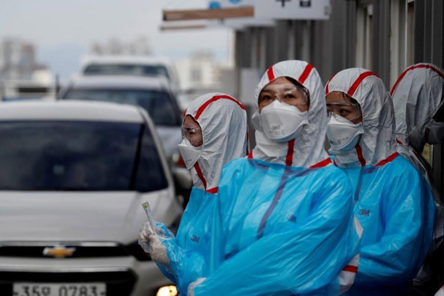 Medical staff in protective gear work at a 'drive-thru' testing centre for the novel coronavirus disease of COVID-19 in Yeungnam University Medical Center in Daegu, South Korea, March 03, 2020. — Reuters