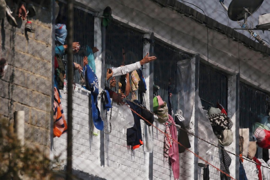 Prisoners are seen in cell windows inside the La Modelo prison after a riot by prisoners demanding government health measures against the spread of the coronavirus disease (COVID-19) in Bogota, Colombia on March 22, 2020 — Reuters photo
