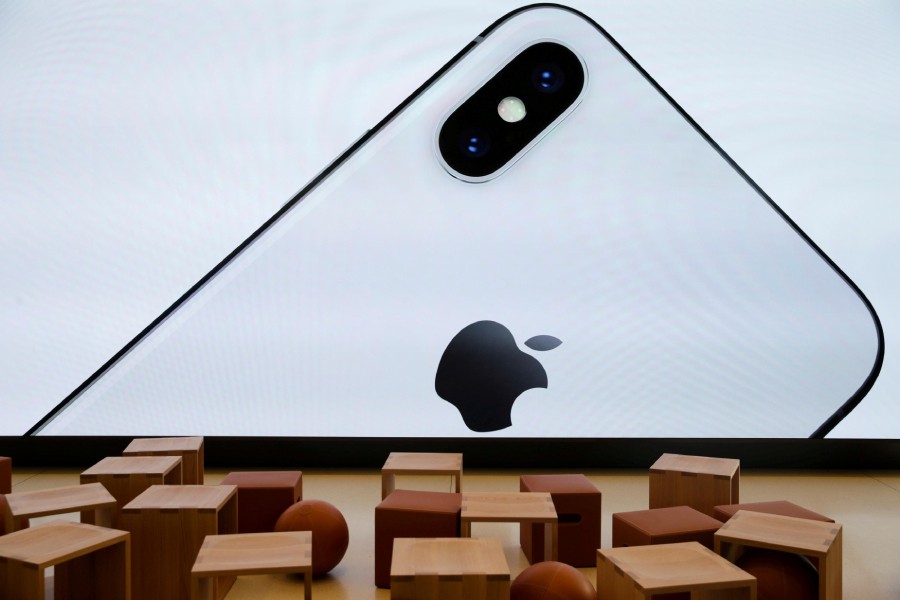 An iPhone X is seen on a large video screen in the new Apple Visitor Center in Cupertino, California, US on November 17, 2017 — Reuters/Files