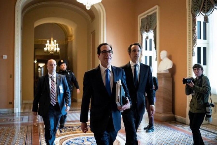 US secretary of the treasury Steven Mnuchin walks to a meeting during negotiations on a coronavirus disease (COVID-19) relief package on Capitol in Washington, March 24, 2020. — Reuters