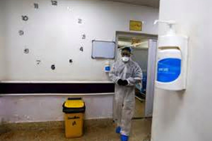 A member of the medical team walks near quarantine room of a hospital, following the outbreak of the new coronavirus, in the holy city of Najaf, Iraq February 24, 2020. REUTERS