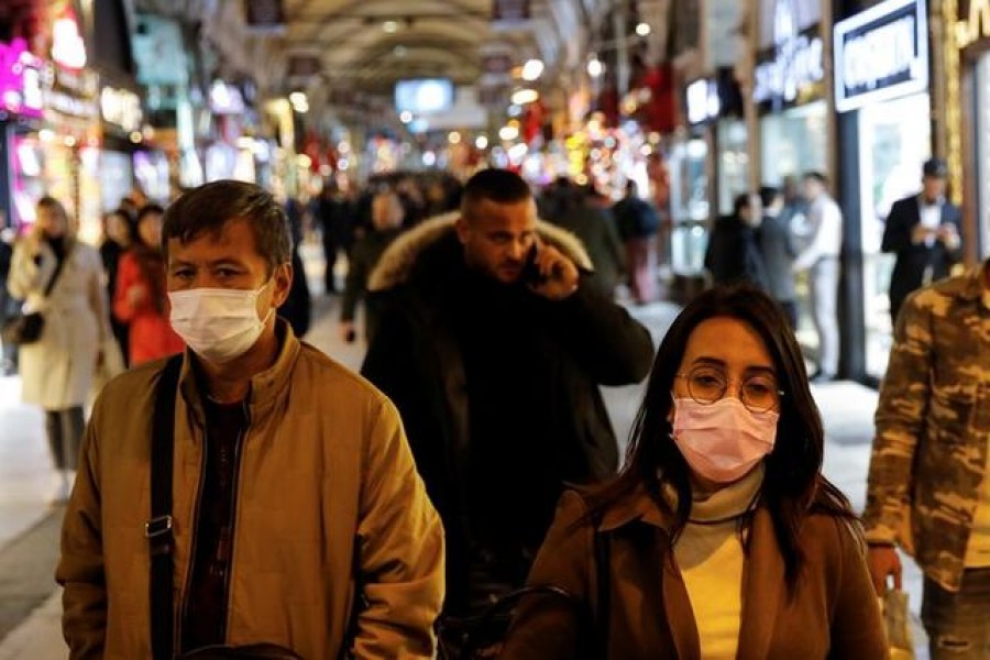 People wear protective face masks due to coronavirus concerns in Istanbul, Turkey March 16, 2020. REUTERS/Umit Bektas